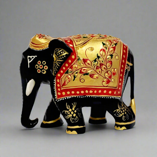 A spectacular wooden elephant statue decorated with beautiful hand painting and a black color finish.