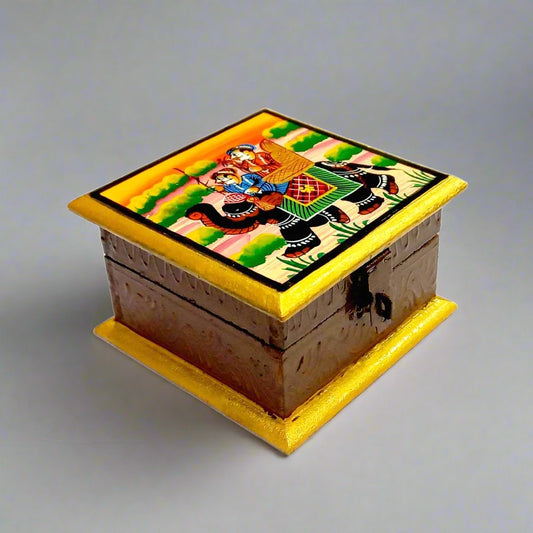 A wooden hand-painted jewelry box with a Raja Savari (elephant) painting on top.