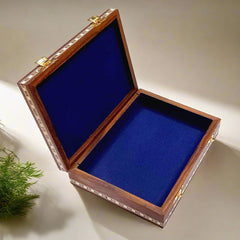 Wooden jewelry box with gemstone art, inlaid border, and blue velvet interior.