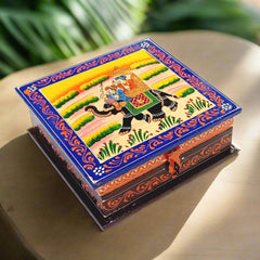 A wooden jewelry box featuring traditional Rajasthani miniature painting.