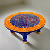 Hand-painted wooden round chowki with intricate traditional designs