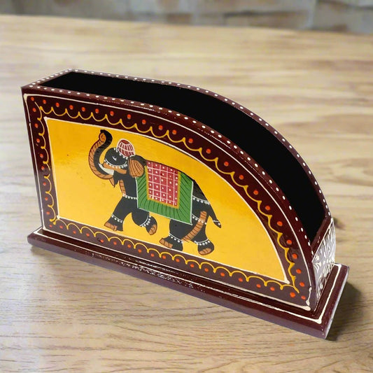 A wooden tissue paper holder for a dining table or kitchen.