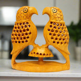 Handmade wooden undercut parrot with intricate lattice carving.