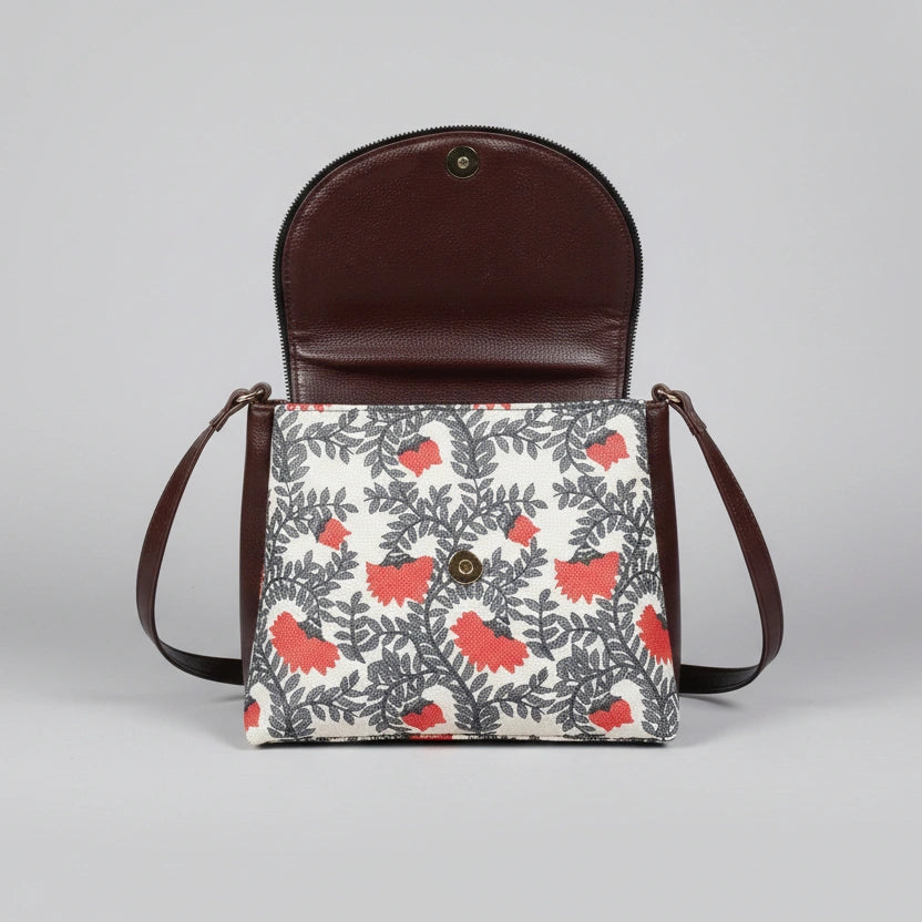 Interior view of the multi-zip sling bag showing the spacious compartments and high-quality lining.