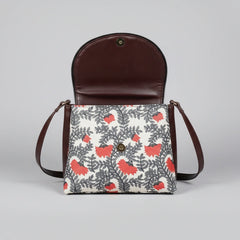 Interior view of the multi-zip sling bag showing the spacious compartments and high-quality lining.