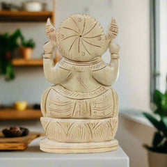 A 15cm carved wooden Ganesh figurine, a beautiful piece for home or office decor.