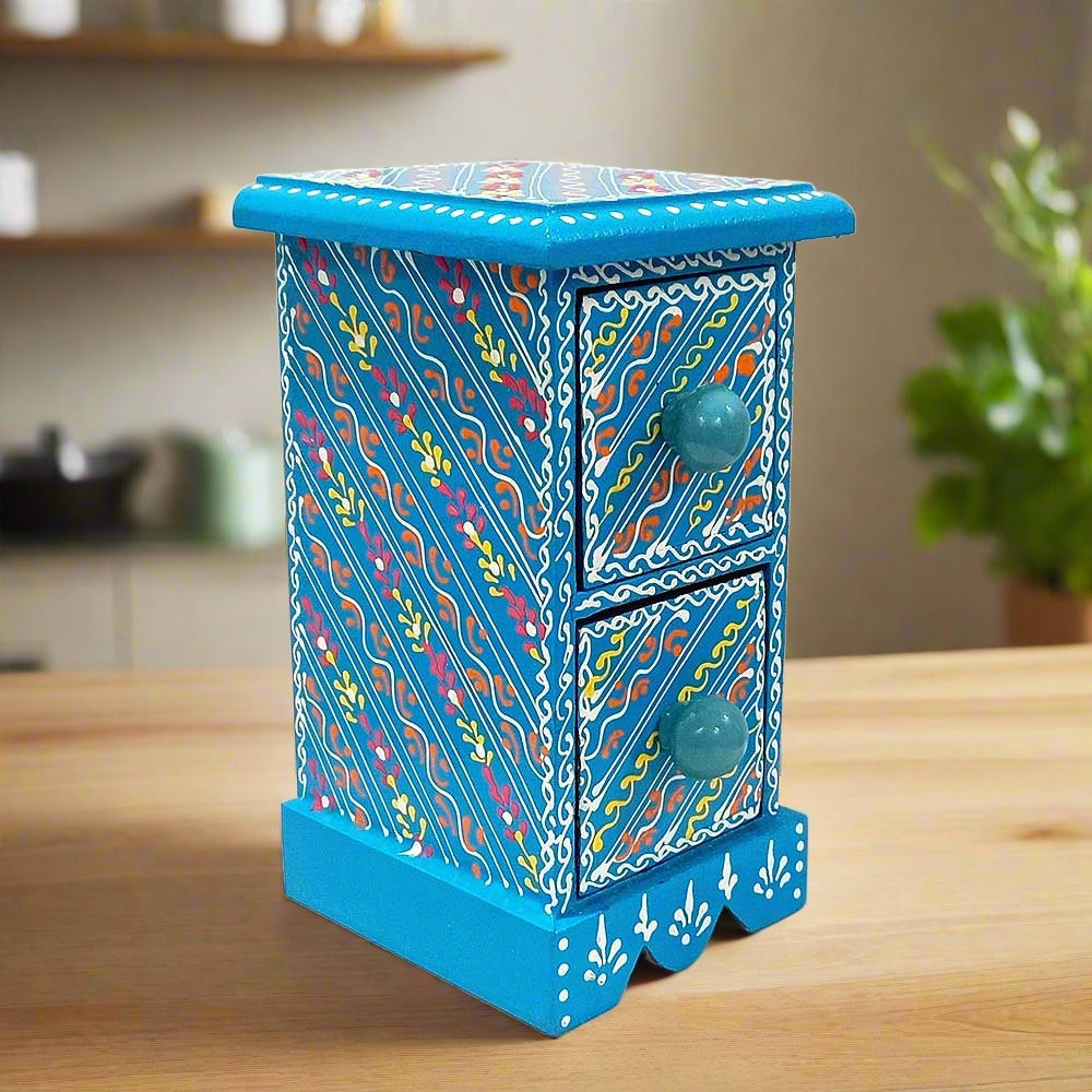 An 18cm beautiful wooden trinket box with two drawers and decorative knobs.