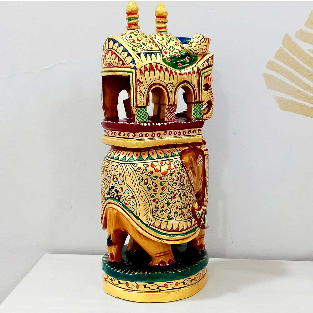 A 23cm hand-painted wooden elephant showpiece, a beautiful piece of traditional art.