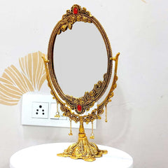 A 33cm golden dressing table mirror with a unique design and a long-lasting polish.
