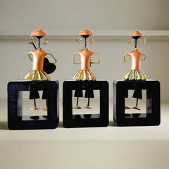 A 3-piece musical dolls showpiece on a wooden frame with amazing hand painting.