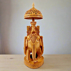 Ambabari elephant wooden idol with detailed carvings of king, queen, and mahout, ideal for living space decor.