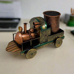 Antique train-shaped metal pen holder with handmade painting and vintage design, perfect for office desk decor.