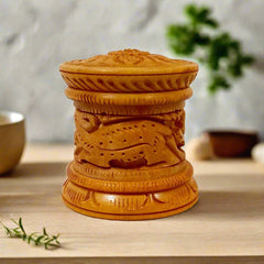 Artisan carved vermilion box made from Dani wood, designed for storing Kumkum and Sindoor decoratively.