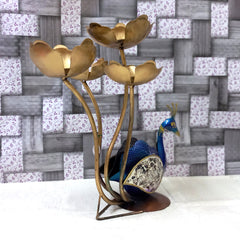 Artistic metal peacock showpiece candle holder with detailed feathers decorated with glass and lotus candle stands, creating a spectacular look.