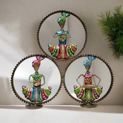 Artistic metal Rajasthani musical set on table with golden circular design, showcasing traditional musician figures.