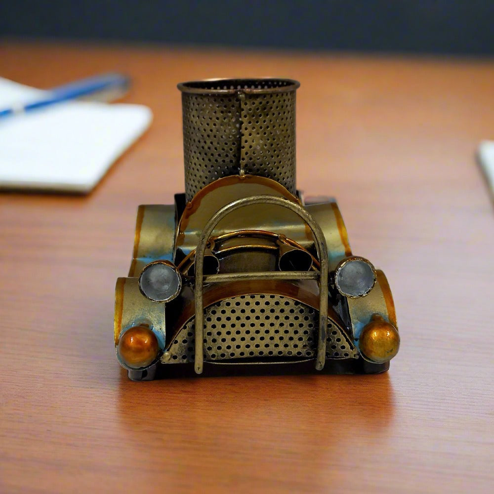 Artistic vintage car metal pen stand featuring circular pen holder and antique design, enhancing office decor.