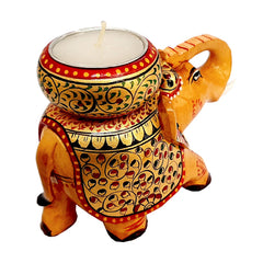 Artistic wooden elephant candle holder with detailed hand painting and round candle stand on the long elephant trunk.