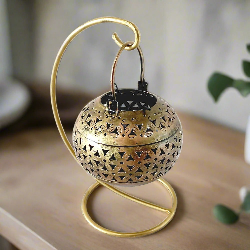 An attractive golden candle holder, a unique and thoughtful gift for a loved one.