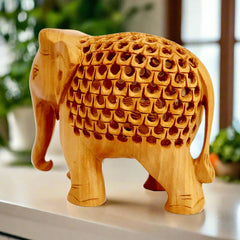 Wooden elephant statue with mesh stomach design carrying baby elephant, crafted for decor and gifting