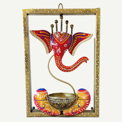 A beautiful Ganesha wall art piece with a candle stand, a very attractive addition to your home decor.