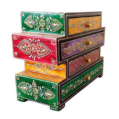 A beautiful painted wooden 4-drawer box with a unique and different shape.