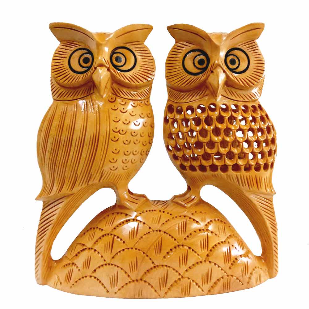Black painted eyes closeup on mesh design owl statue single wood piece impressive handicraft