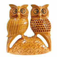 Black painted eyes closeup on mesh design owl statue single wood piece impressive handicraft