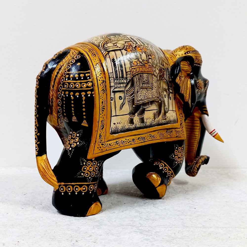 Black Kadamba wood elephant with gold and white painting details, featuring miniature art on back sides.