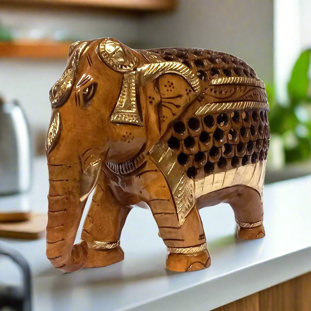 An attractive brown and golden colored wooden elephant, best for home or office decoration.