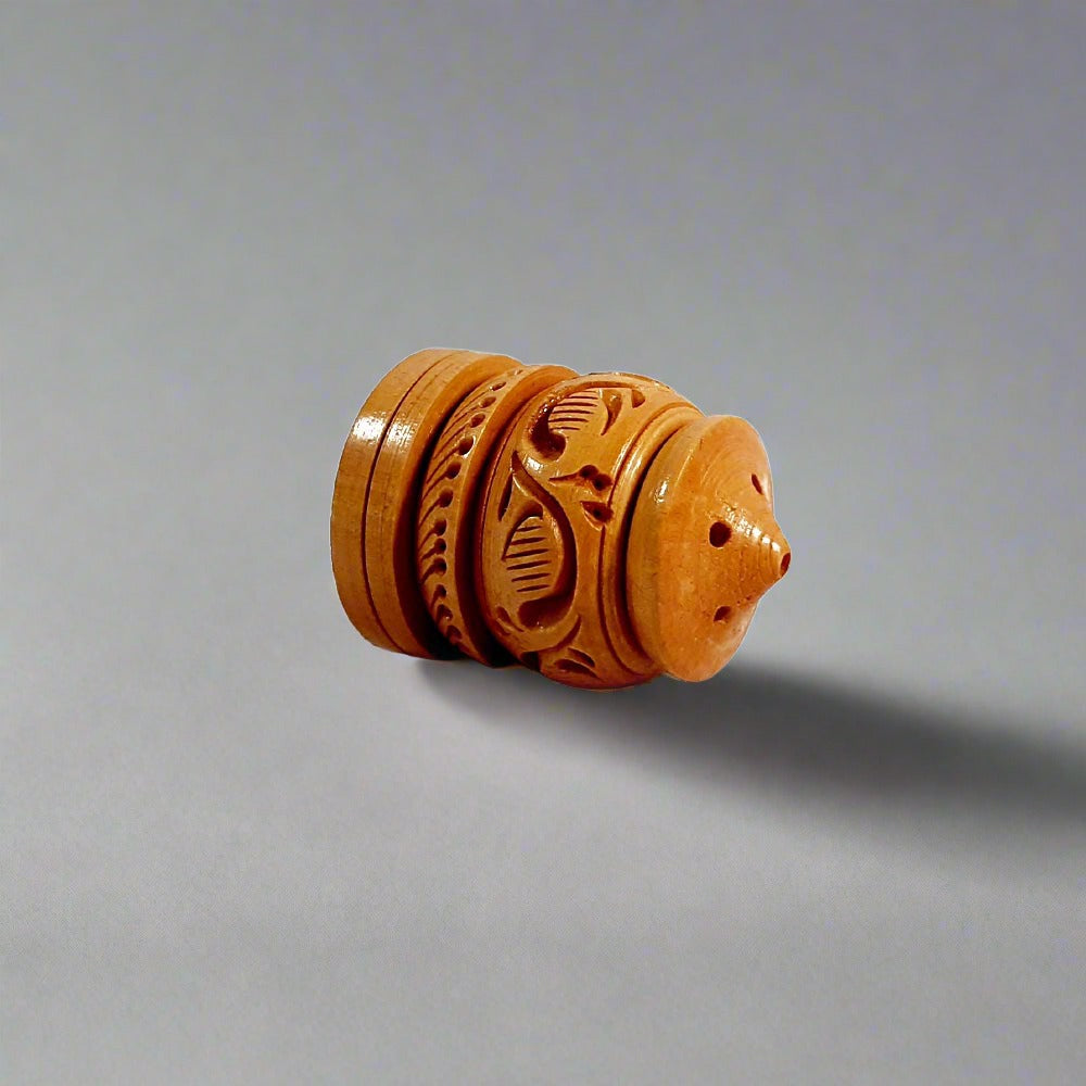 A carved wood agarbatti stand for a prayer room, with beautiful carving.