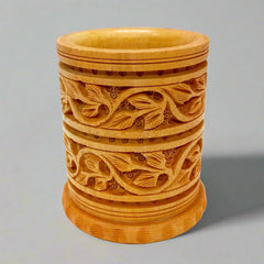Round carved wooden pen stand made of dried Kadamba wood, sturdy and elegant for office use
