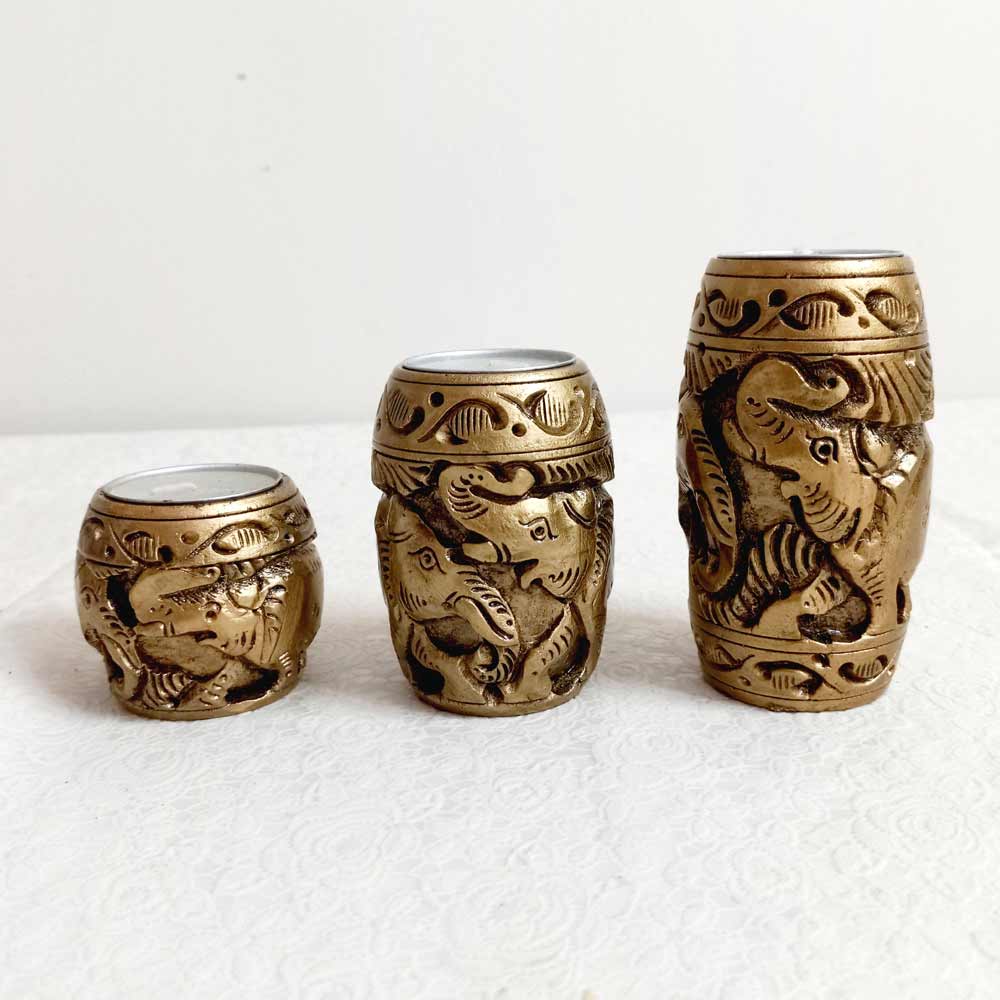 A pack of 3 carved wood tea light candle holders, a great gift for any occasion.