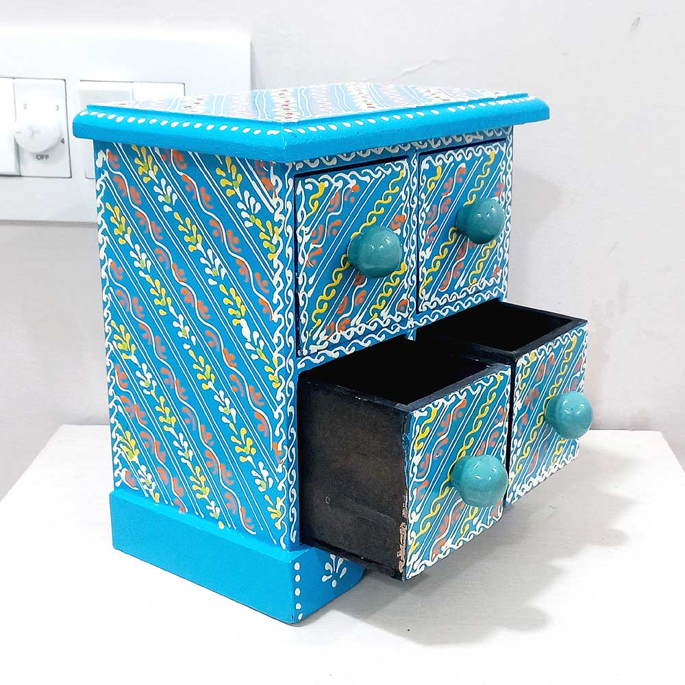 A colorful wooden jewelry gift box with 4 drawers, a perfect way to store or present jewelry.