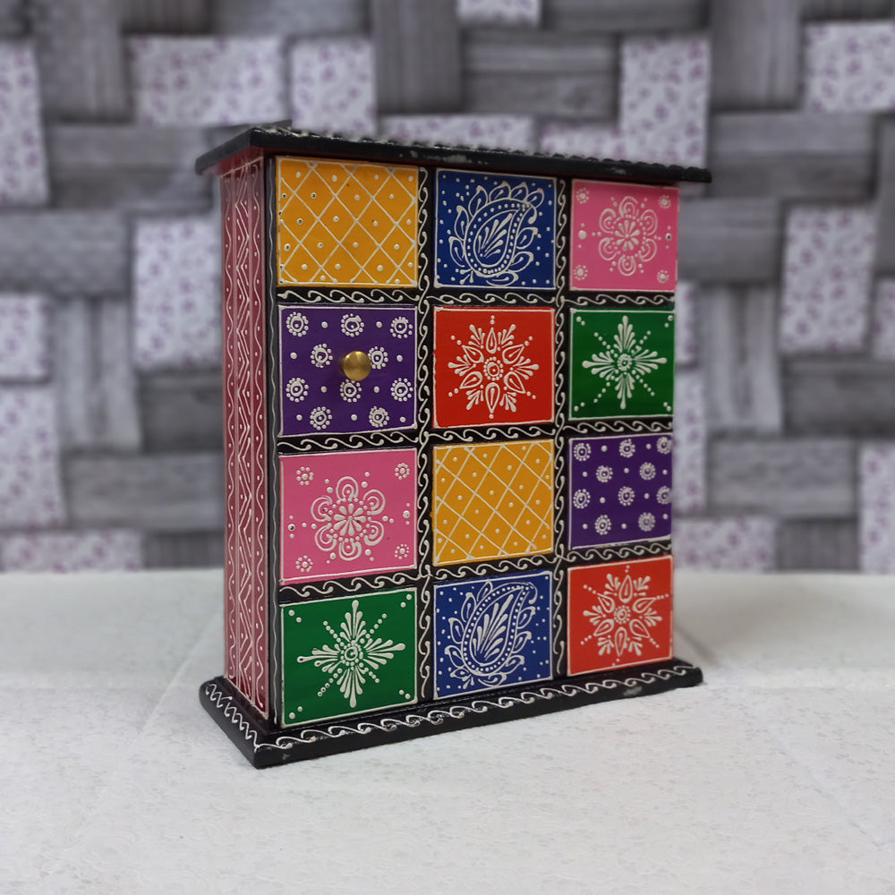 Colorful wooden key box with hand-painted designs, wall-mounted for easy access and stylish decor.
