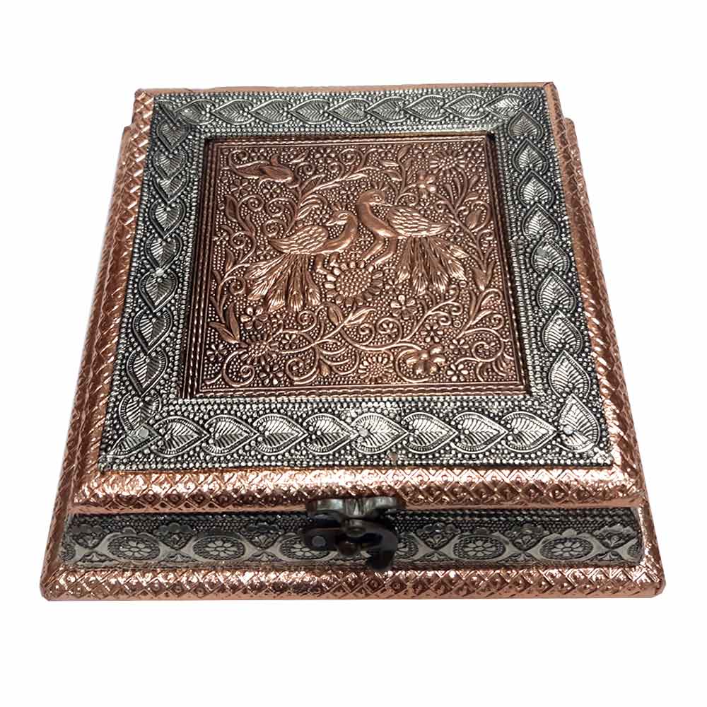 Close-up lid detail of raised peacock and border floral designs on wooden dry fruit box