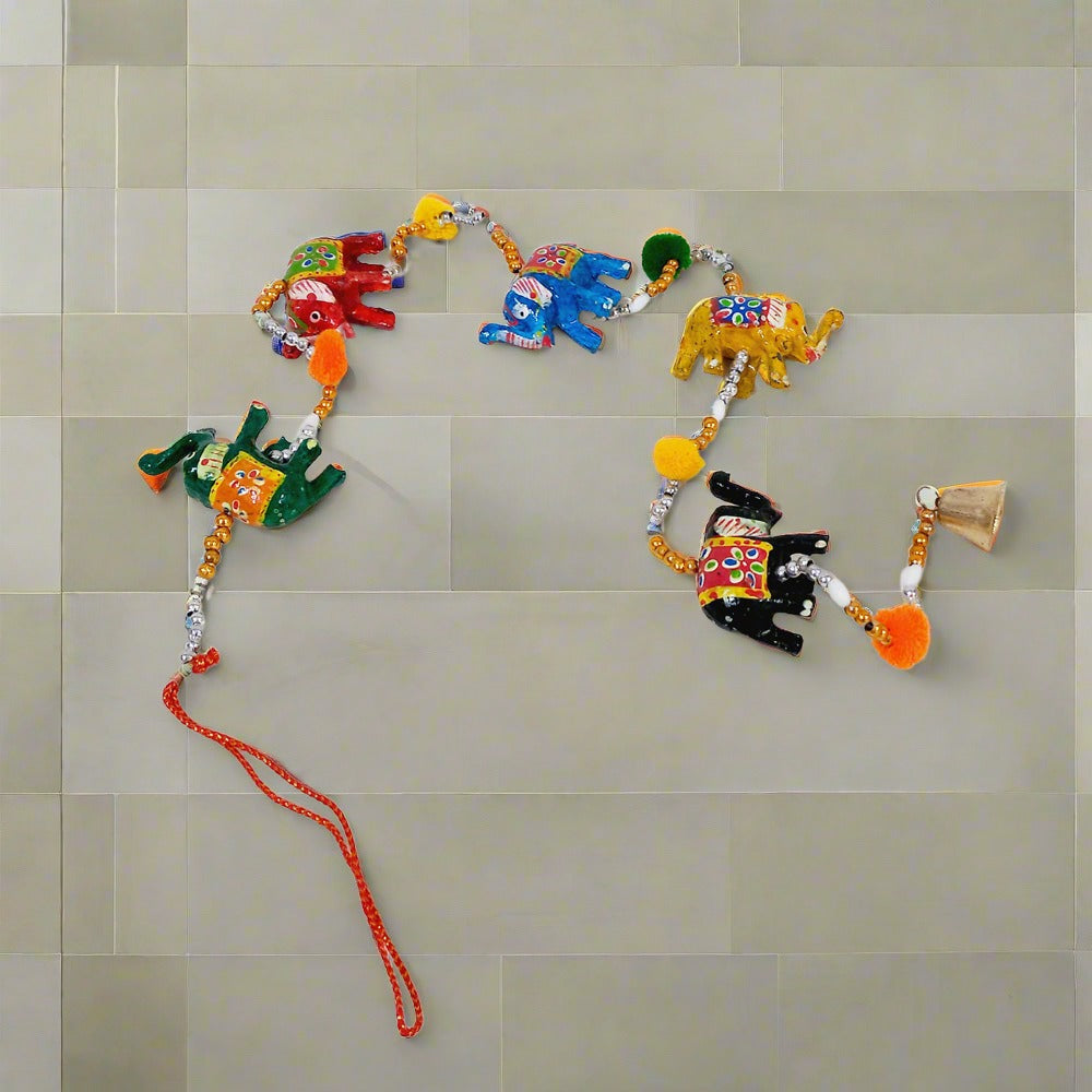 Colorful papier-mâché elephant toran featuring hand painted elephants and decorative beads for home or office