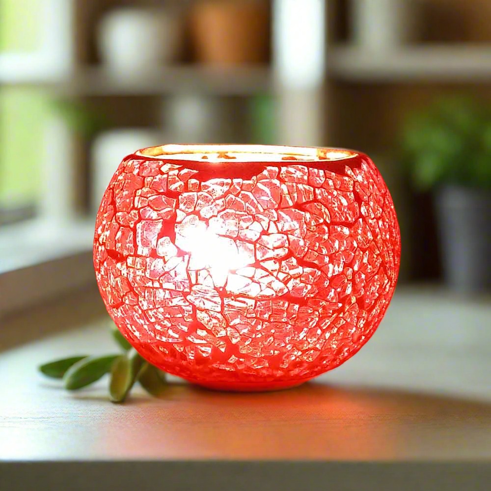 Decorative glass candle holder with crackle design that beautifully glows when lit, suitable for gifting and home decor.