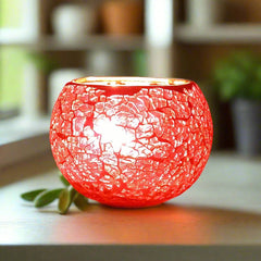 Decorative glass candle holder with crackle design that beautifully glows when lit, suitable for gifting and home decor.
