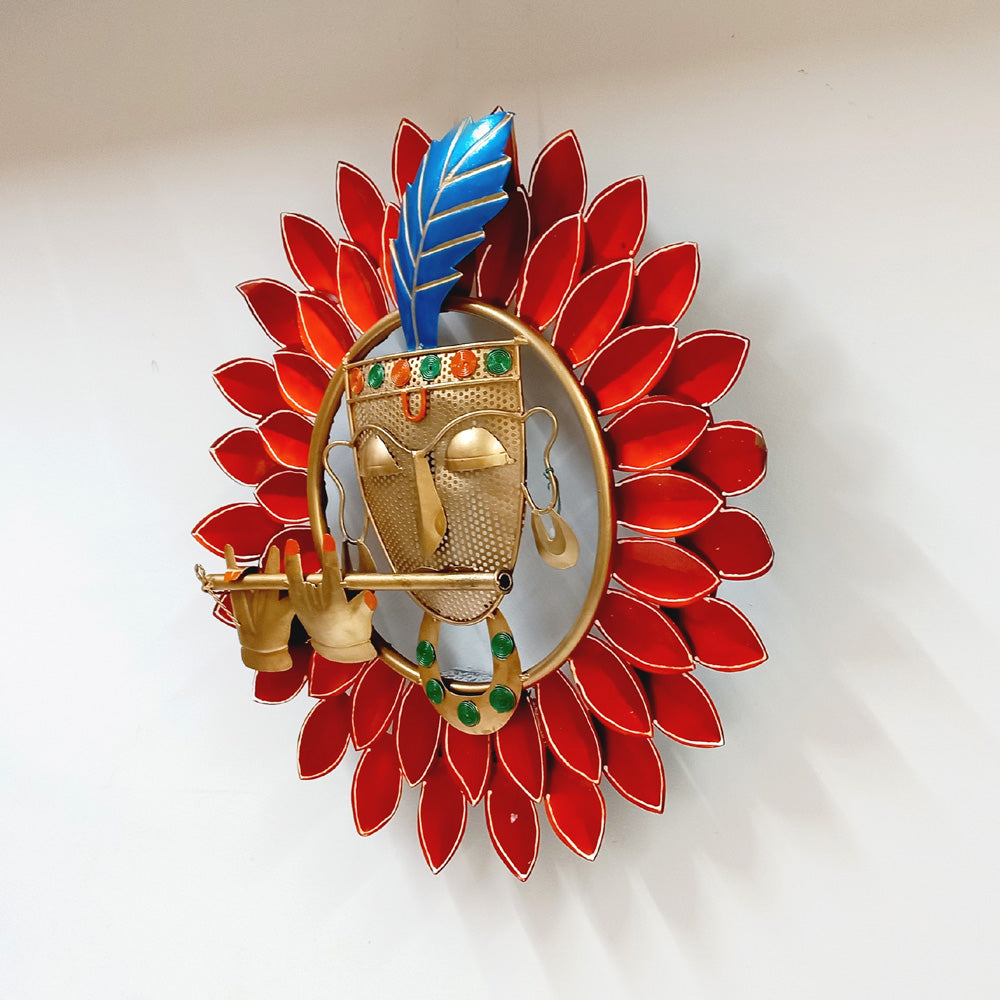 Decorative metal wall frame with beautiful hand painting of Kishan ji’s face on vibrant red double leaves.