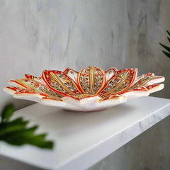 Decorative pure marble urli with lotus design, hand-painted and ideal for holding worship flowers in pooja room.