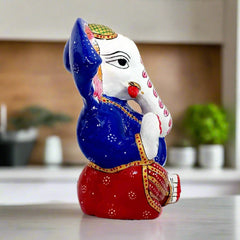 Decorative Meenakari Ganesha idol with big ears and beautiful face, suitable for office and home pooja spaces