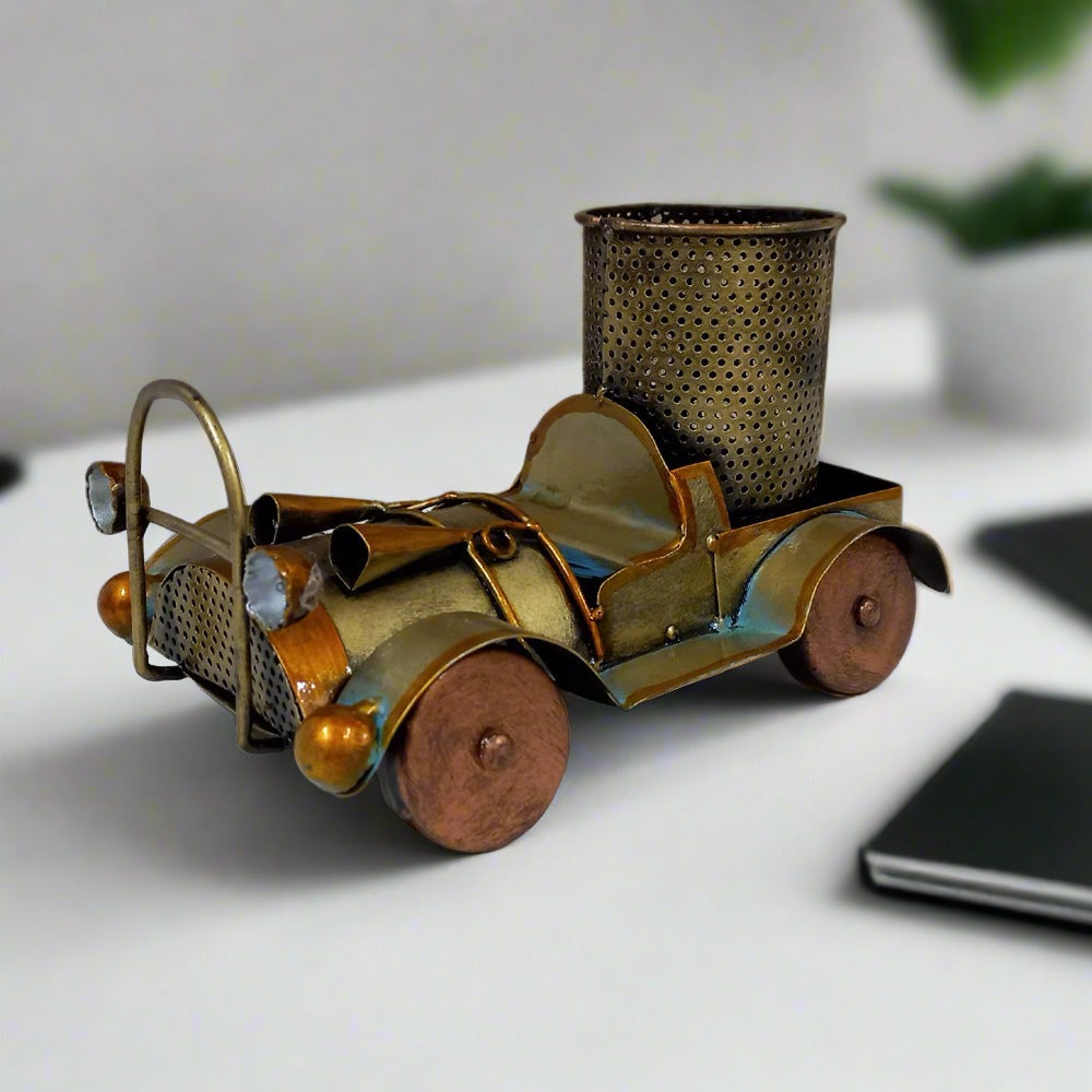 Decorative vintage car metal pen stand with beautiful antique finish and ample space for writing instruments.