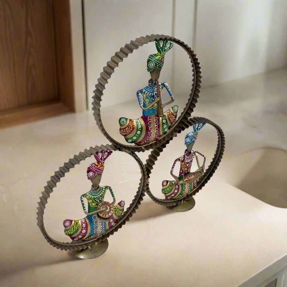 Decorative Rajasthani musician set with gold ring frame, featuring figures playing tabla, flute, and other instruments.