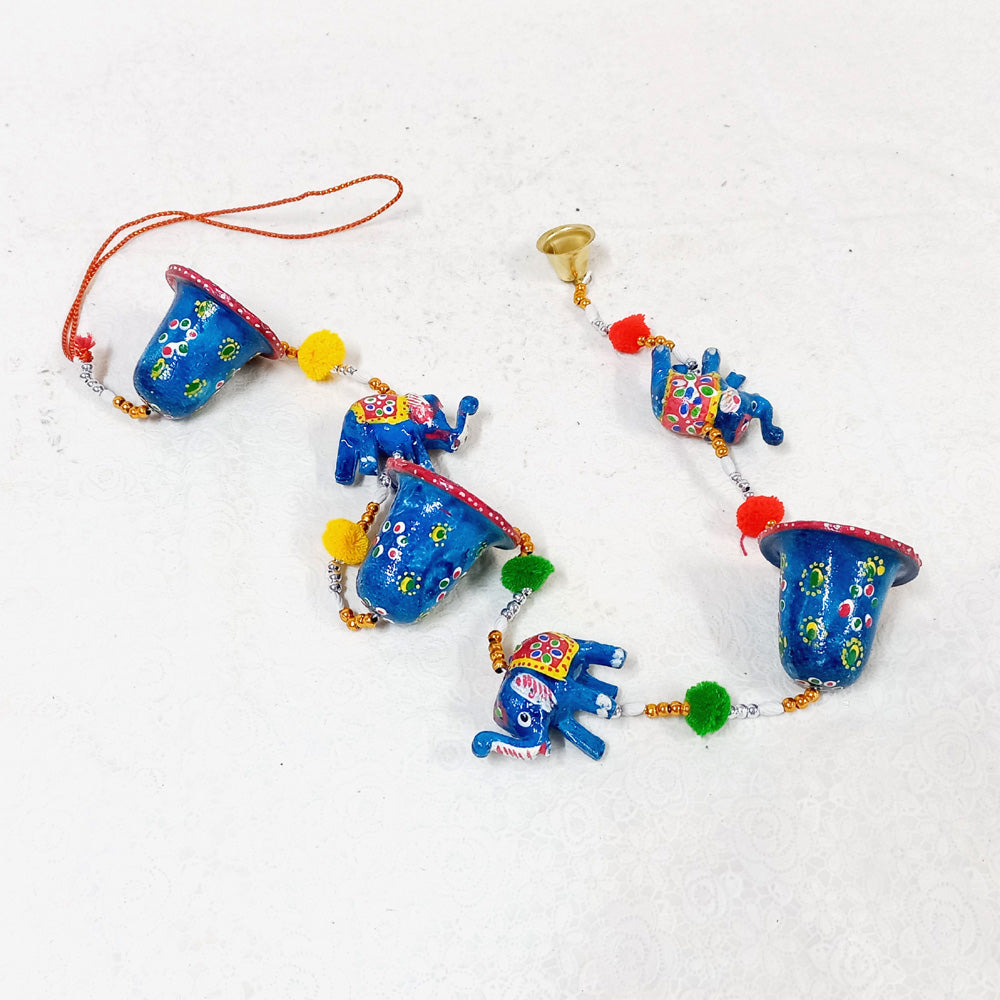 Decorative toran with elephant and bells for wall decor.