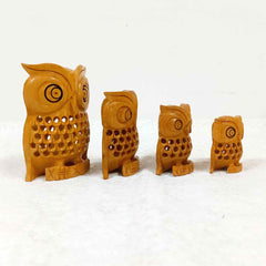 Decorative wooden owl set in sizes from 2 to 4 inches with fine mesh design and black eyes.