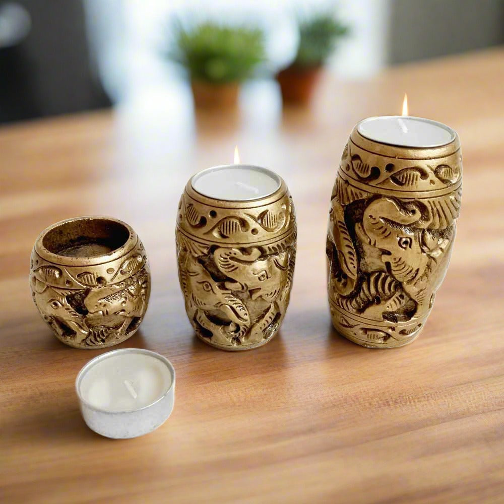 A decorative wooden t-light holder set, ideal for table decor or as a showpiece.