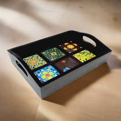 Decorative wooden tray with vibrant hand art and varied ceramic tile patterns, ideal for home or office use.