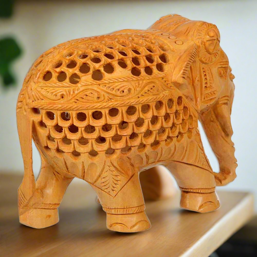 Decorative wooden undercut elephant figurine for gifting and interior decor.