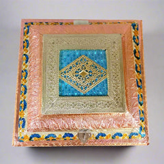 Close-up lid and border painting detail on wood and metal foil dry fruit box