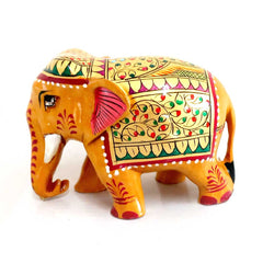 Elegant wooden elephant hand-painted with bright floral motifs in red and green on golden background